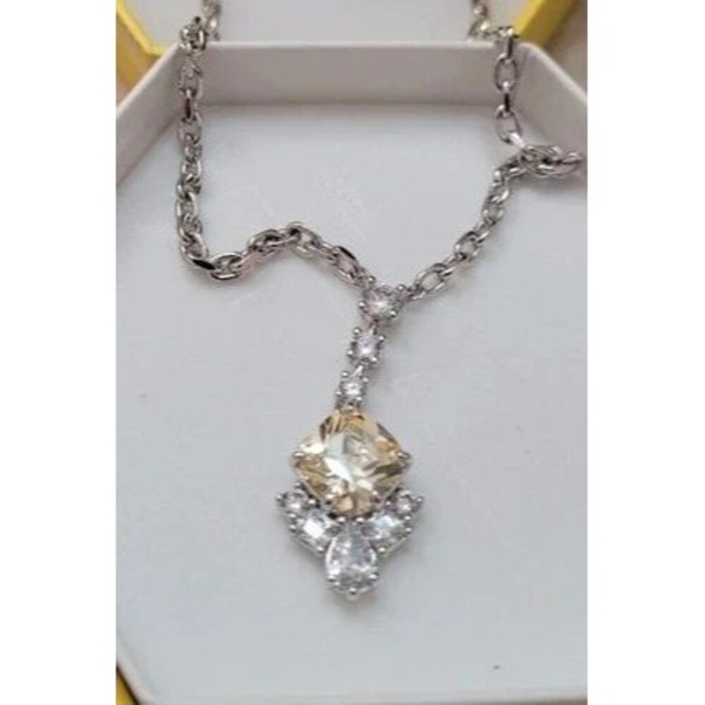 Necklace with gold colored stone.